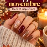 Des mains avec une manucure tendance de novembre 2026, présentant des couleurs automnales et des designs élégants.